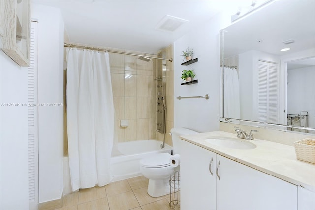 full bathroom featuring shower / bath combination with curtain, tile patterned floors, vanity, and toilet