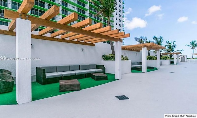 view of patio / terrace with an outdoor living space and a pergola