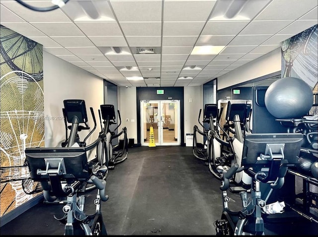 exercise room featuring a drop ceiling