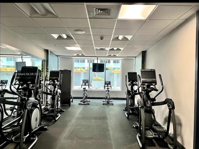 gym featuring a paneled ceiling