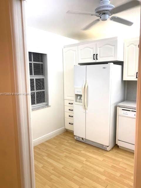 kitchen with white cabinetry, light hardwood / wood-style floors, white appliances, and ceiling fan