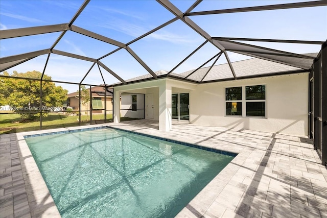 view of swimming pool with a lanai and a patio