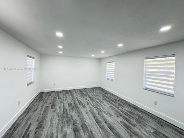 unfurnished room featuring dark hardwood / wood-style flooring