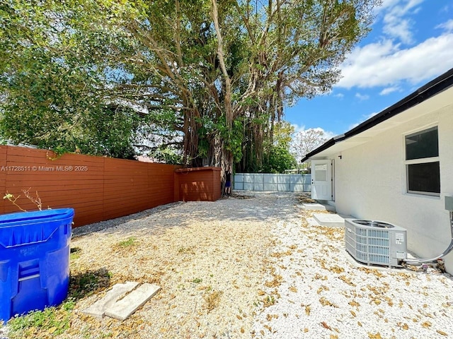 view of yard with central AC