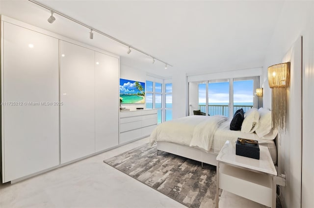 bedroom featuring a water view