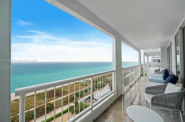 balcony featuring a water view