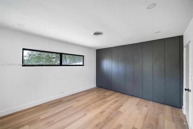 unfurnished bedroom featuring light hardwood / wood-style flooring