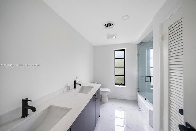 full bathroom with toilet, vanity, and combined bath / shower with glass door