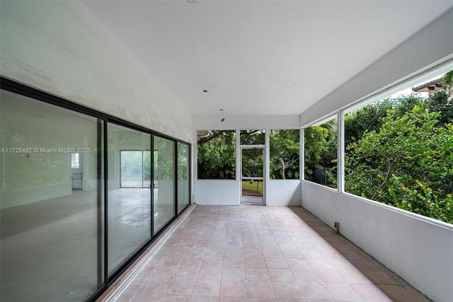 unfurnished sunroom with plenty of natural light