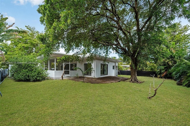 view of yard with a sunroom