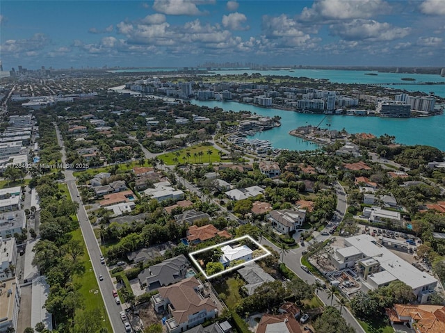 birds eye view of property featuring a water view