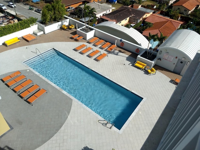 view of swimming pool featuring a patio area