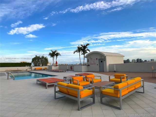 view of swimming pool with an outdoor hangout area and a patio area