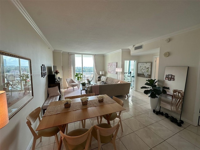 tiled dining space featuring ornamental molding