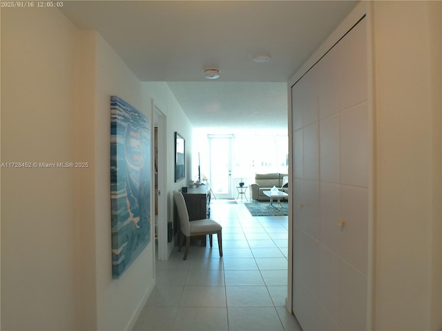 hall with light tile patterned flooring