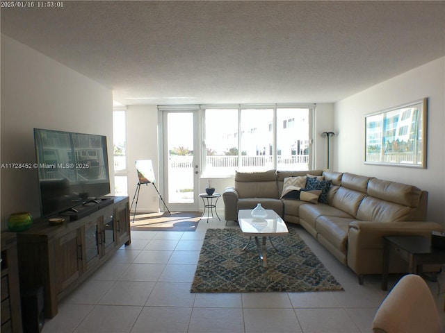 tiled living room with a textured ceiling