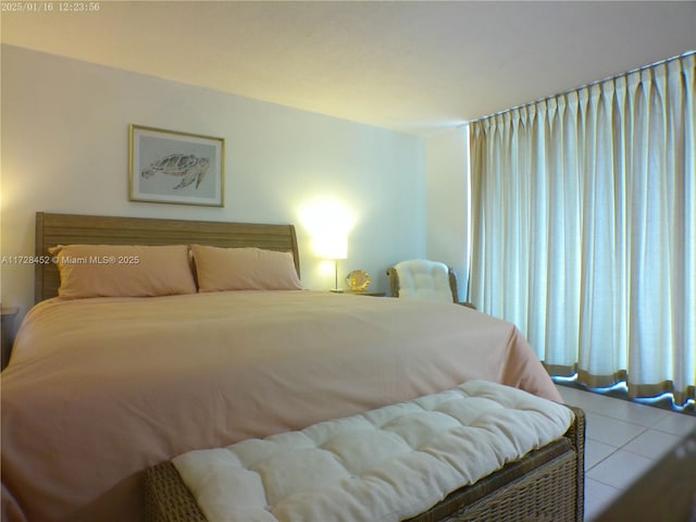 bedroom featuring light tile patterned floors