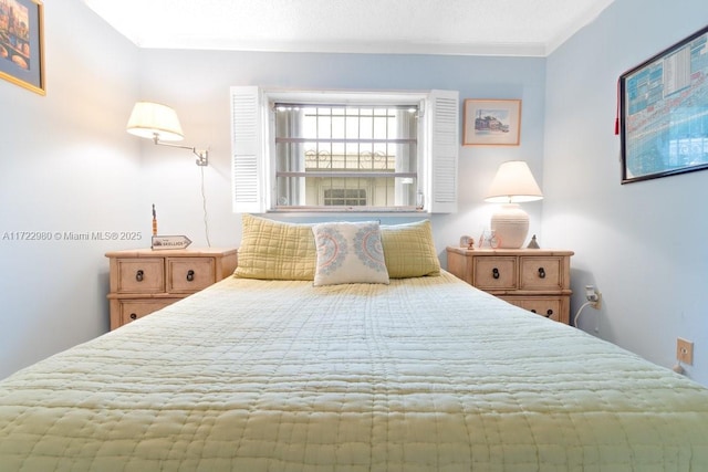 bedroom featuring crown molding