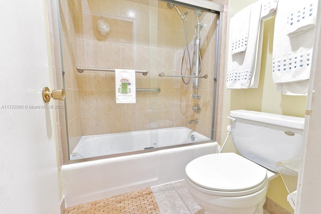 bathroom with toilet, tile patterned flooring, and enclosed tub / shower combo