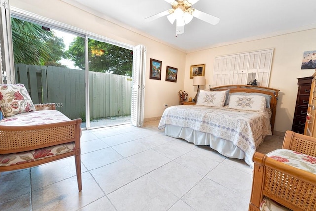 bedroom with ceiling fan, access to exterior, and light tile patterned floors