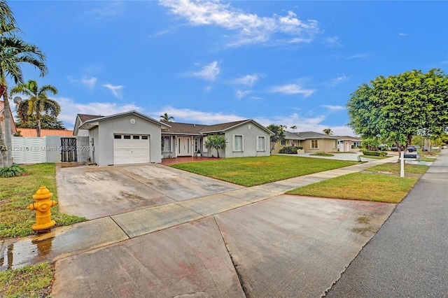 single story home with a front lawn and a garage