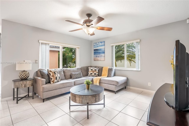 living room featuring ceiling fan and light tile patterned floors