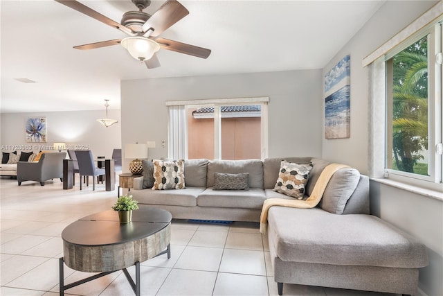 tiled living room featuring ceiling fan