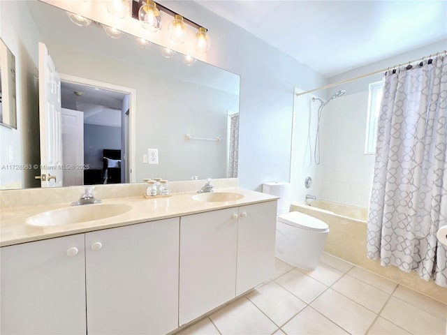 full bathroom featuring vanity, tile patterned floors, toilet, and shower / bath combo with shower curtain