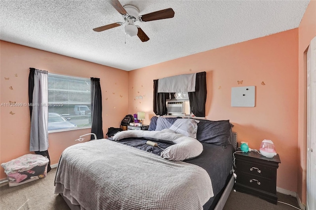 bedroom featuring ceiling fan, cooling unit, a textured ceiling, and carpet flooring