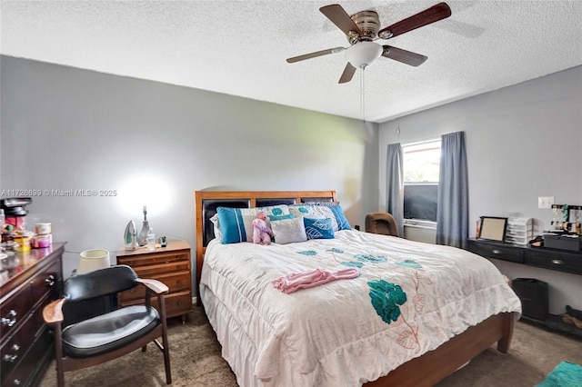 bedroom featuring carpet, a textured ceiling, and ceiling fan