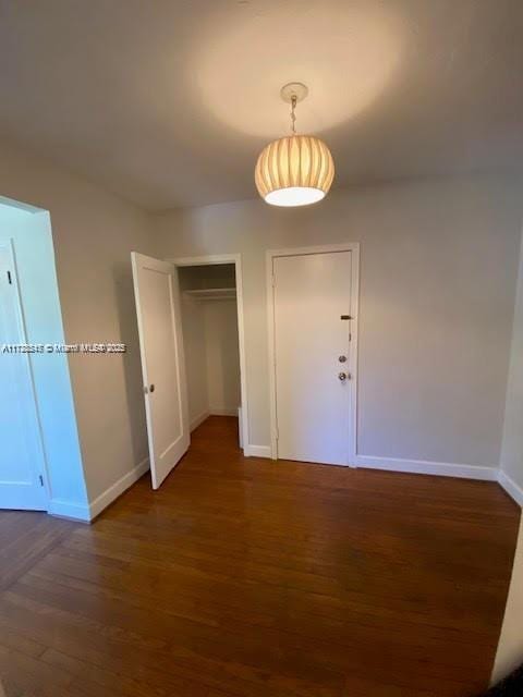 spare room featuring dark hardwood / wood-style flooring