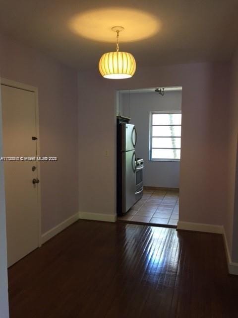 spare room featuring hardwood / wood-style flooring