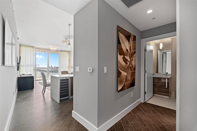 corridor featuring expansive windows and wine cooler