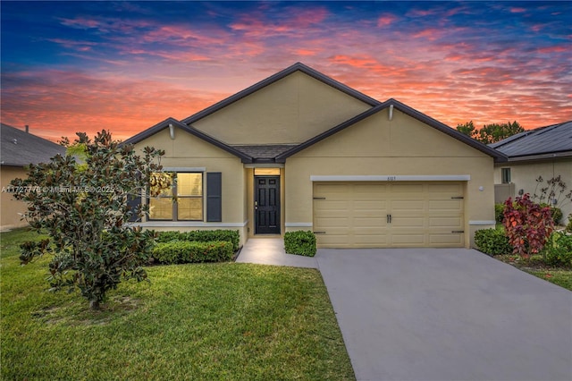 single story home with concrete driveway, a front lawn, a garage, and stucco siding