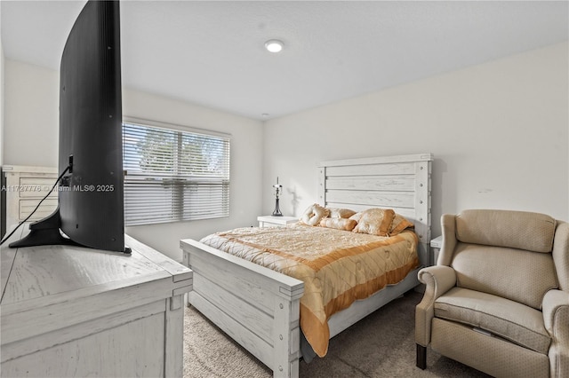 bedroom featuring light colored carpet