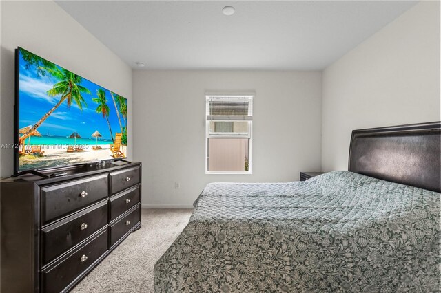 bedroom with light colored carpet