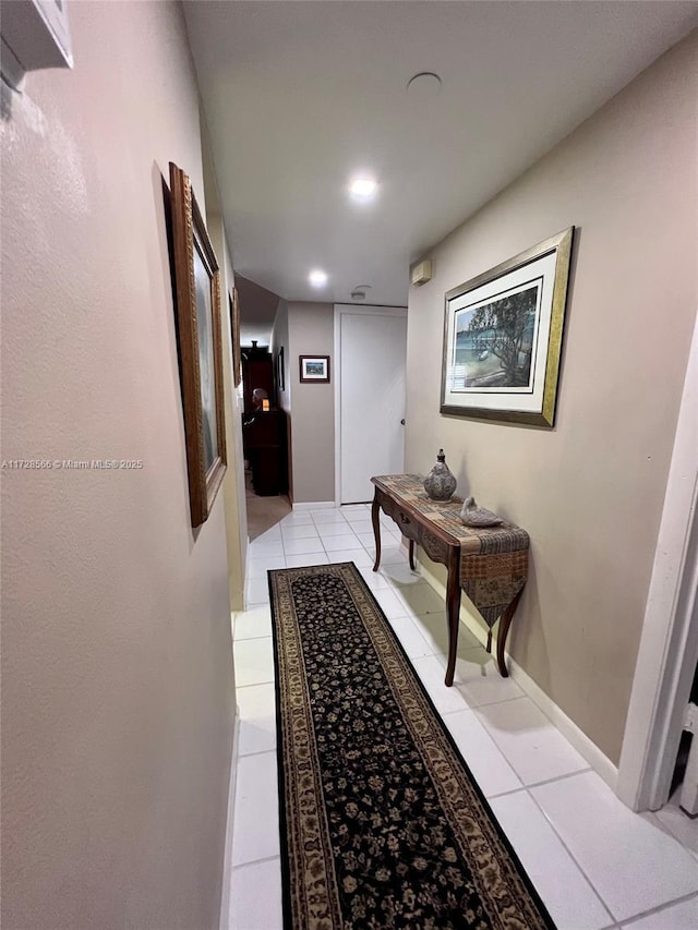 hallway featuring light tile patterned floors