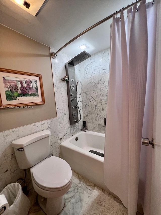 bathroom with toilet, shower / bathtub combination with curtain, and tile walls