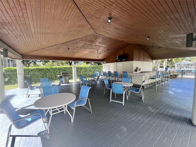 view of patio featuring an outdoor bar