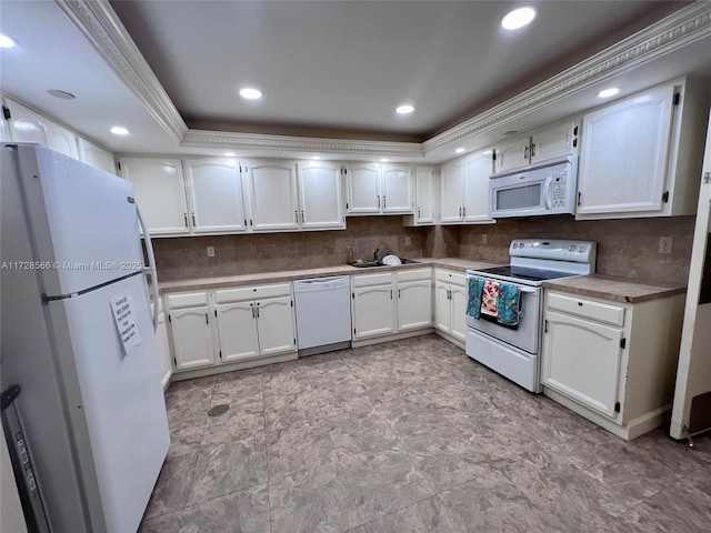 kitchen featuring sink, white cabinets, tasteful backsplash, and white appliances