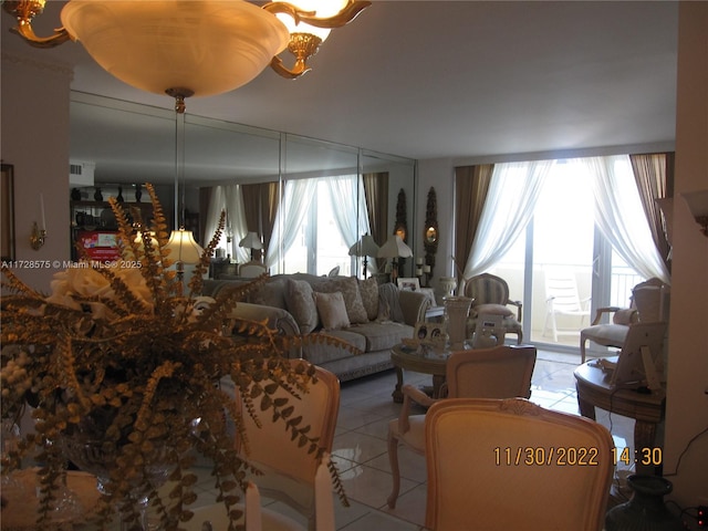 living room featuring a wealth of natural light and light tile patterned floors