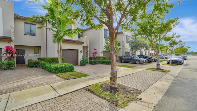 townhome / multi-family property featuring a garage