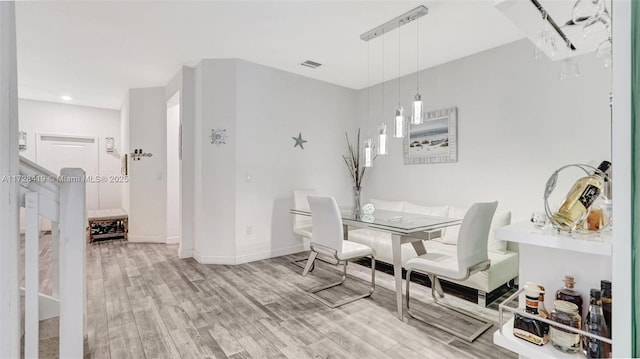 dining area featuring hardwood / wood-style floors