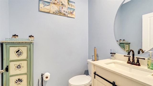 bathroom with toilet and vanity