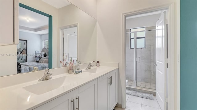 bathroom with toilet, vanity, tile patterned flooring, and walk in shower