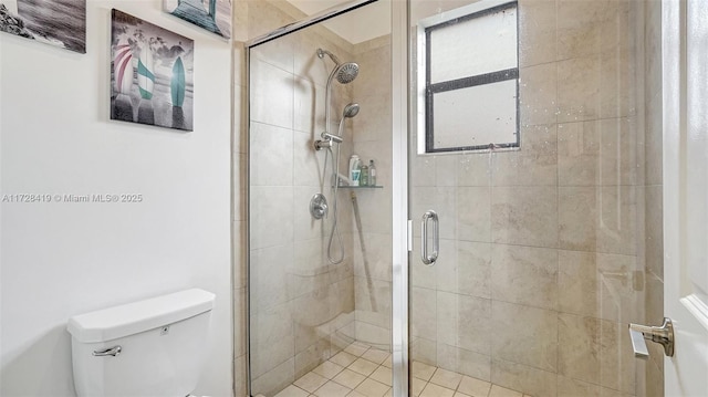 bathroom featuring an enclosed shower and toilet