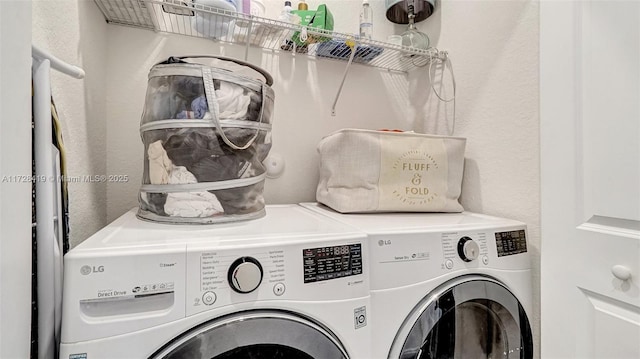 laundry area with washing machine and clothes dryer