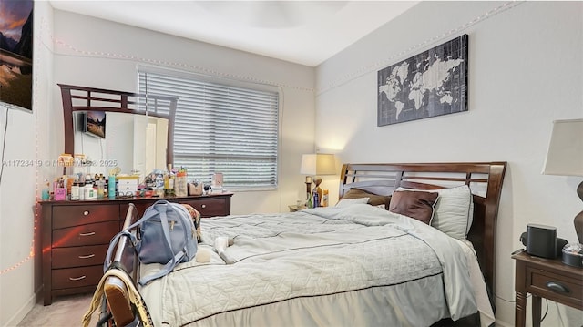 bedroom with light colored carpet