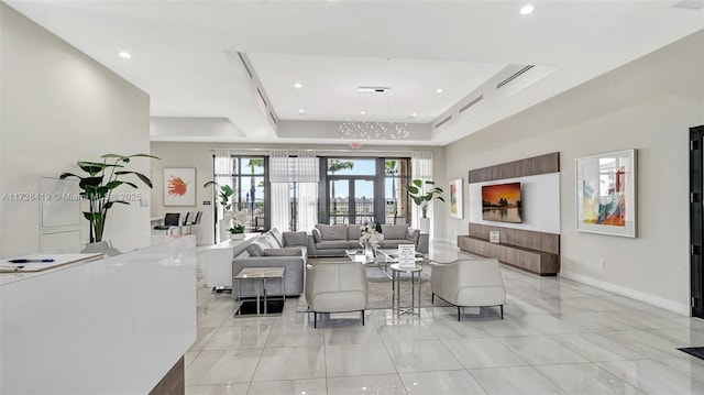 interior space featuring a tray ceiling and french doors