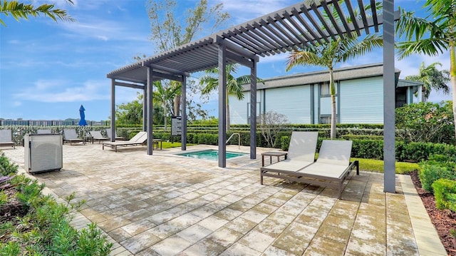 view of patio / terrace featuring a pool and a pergola